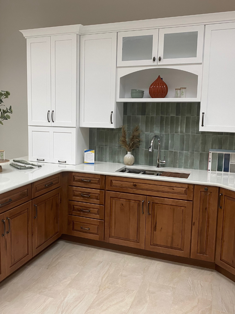 brown and white cabinets in a kitchen display