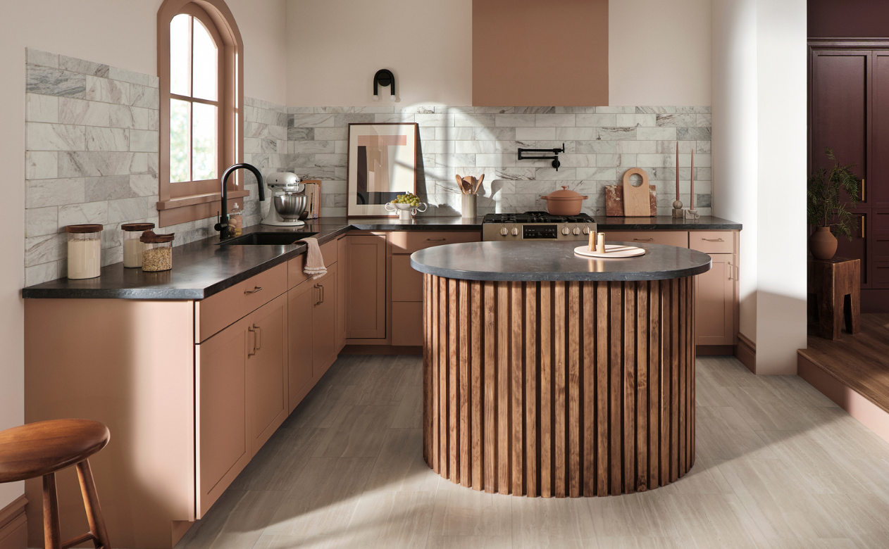 Black countertops in a kitchen with terracotta cabinetry