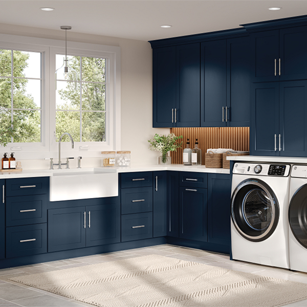 Laundry Room display with blue cabinetry and sink