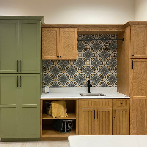 Laundry Room display with natural and green cabinets