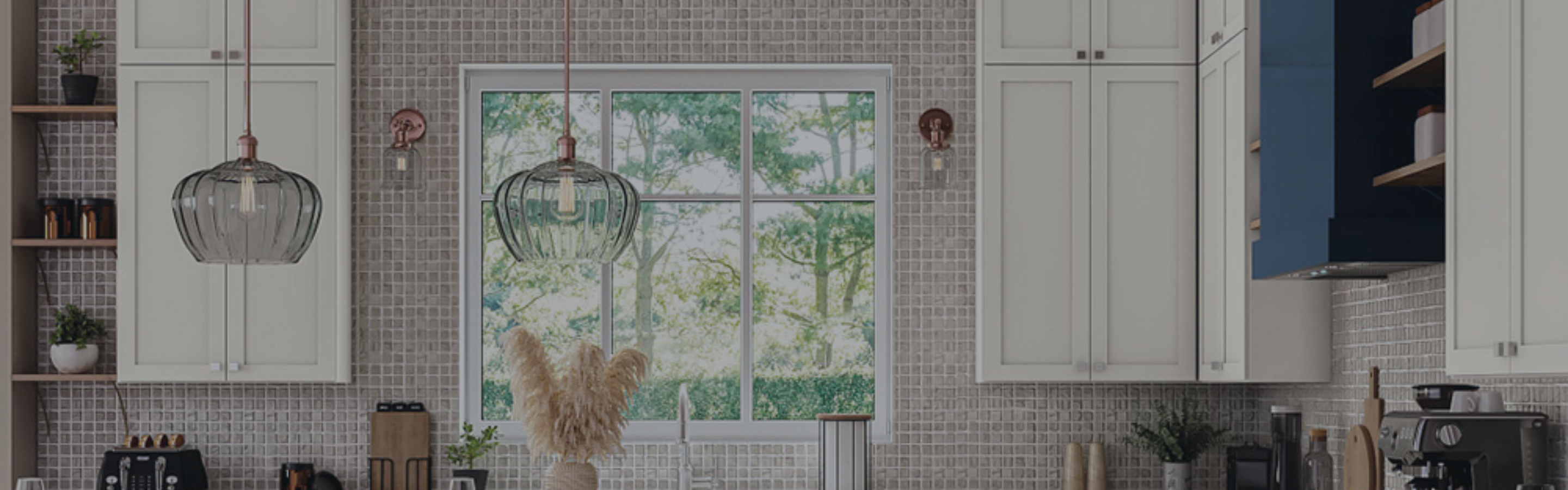 Wall sconces and pendant lighting in a designer kitchen