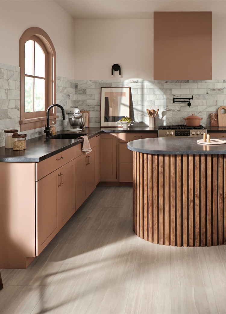 white countertops in a kitchen with blue and white cabinetry