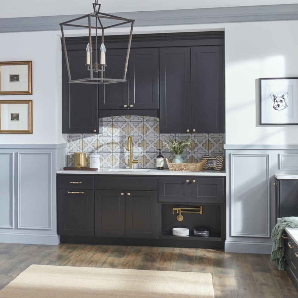 Custom cabinets with a nook for pet food bowls and attached water filler